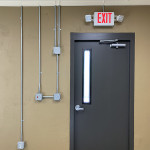Conduit runs at exit door