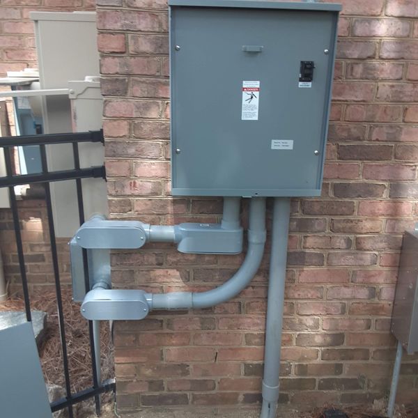 Transfer switch mounted on a brick wall